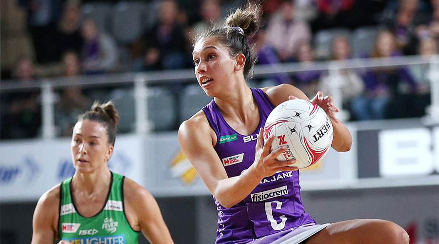 Jemmi MiMi from Firebirds with the ball