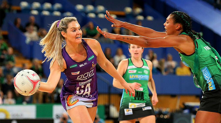 Gretel Tippett of the Queensland Firebirds passes the ball around Stacey Francis of the fever during the round 13 Super Netball match between the West Coast Fever and the Queensland Firebirds at RAC Arena on August 18, 2019 in Perth, Australia. 