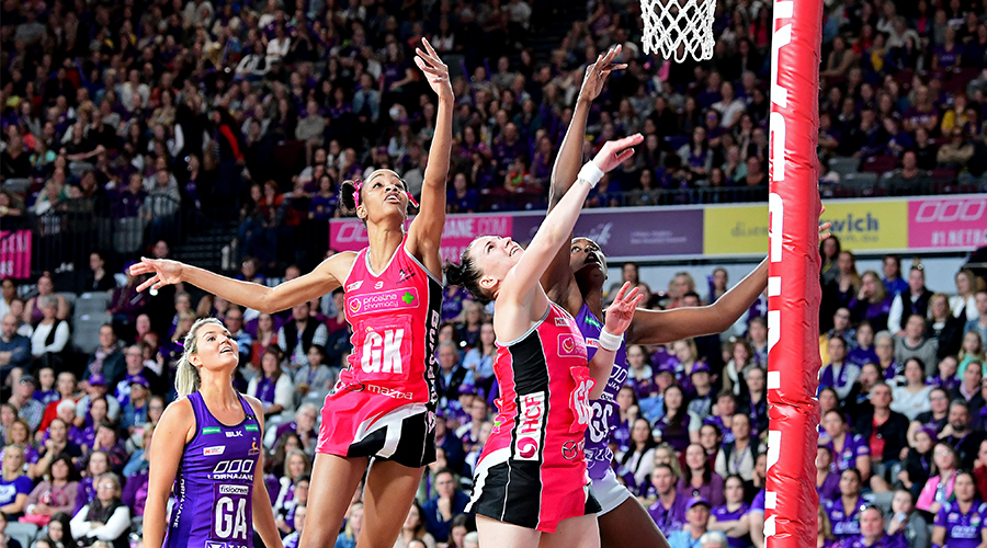 Romelda Aiken of the Firebirds is challenged by the defence of Shamera Sterling and Kate Shimmin of the Thunderbirds during the round 12 Super Netball match between the Queensland Firebirds and Adelaide Thunderbirds at Brisbane Arena on August 11, 2019 in Brisbane, Australia. 