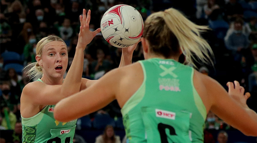 Sasha Glasgow of the Fever passes the ball Jess Anstiss of during the Round 2 Super Netball match between the West Coast Fever and the NSW Swifts at RAC Arena in Perth, Saturday, May 8, 2021