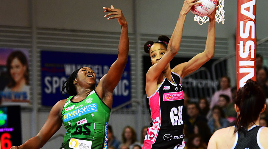 Shamera Sterling jumping for the ball with Jhaniele Fowler trying to deflect the pass