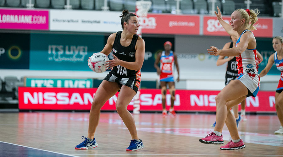 Kelsey Browne with the ball against the Swifts