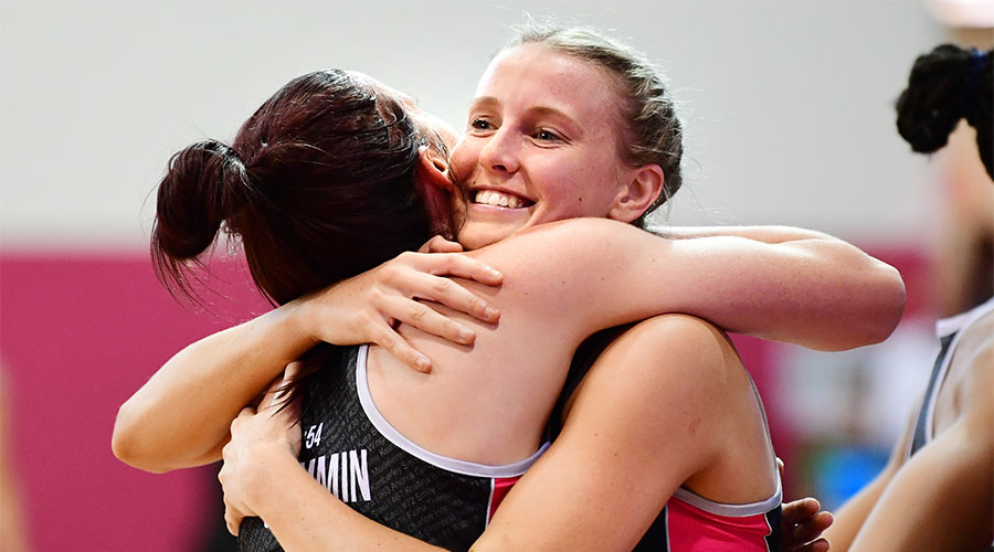 Sasha Glasgow hugging fellow team mate Kate Shimmin