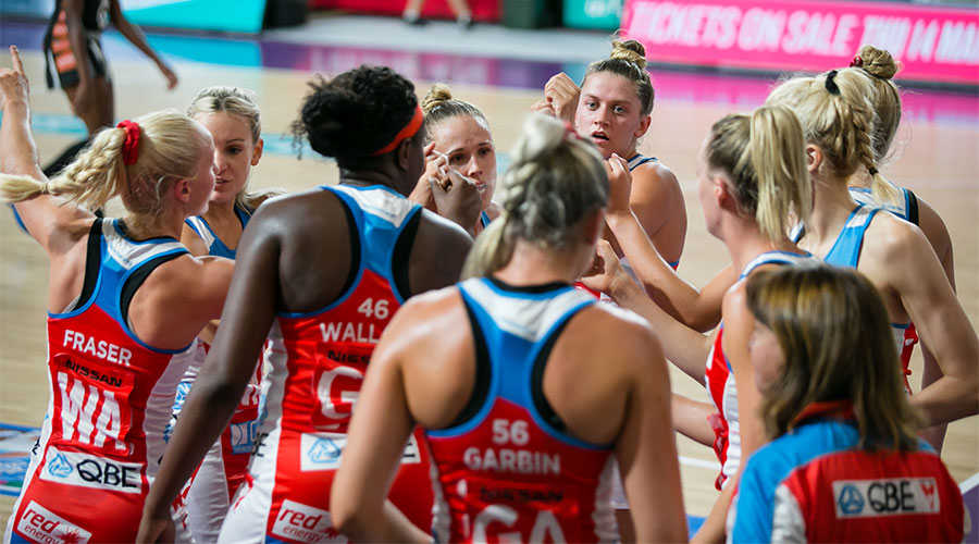 The Swifts in a team huddle