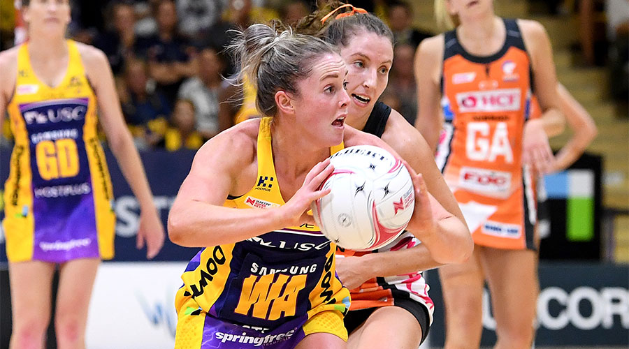 Lightning's Laura Scherian passing the ball with Amy Parmenter defending