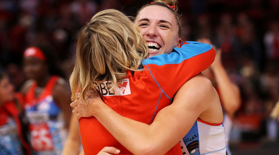Swifts Sarah Klau and Coach Briony Akle hug after winning their round 8 game