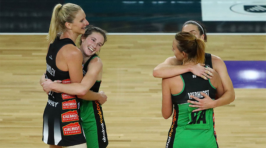 Ingrid Colyer and Nat Medhurst embracing April Brandley and Ash Brazill after the game