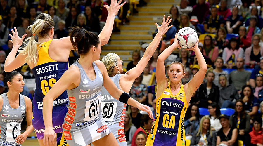 Steph Wood looking to pass the ball to Caitlin Bassett with April Brandley and Sharni Layton defending
