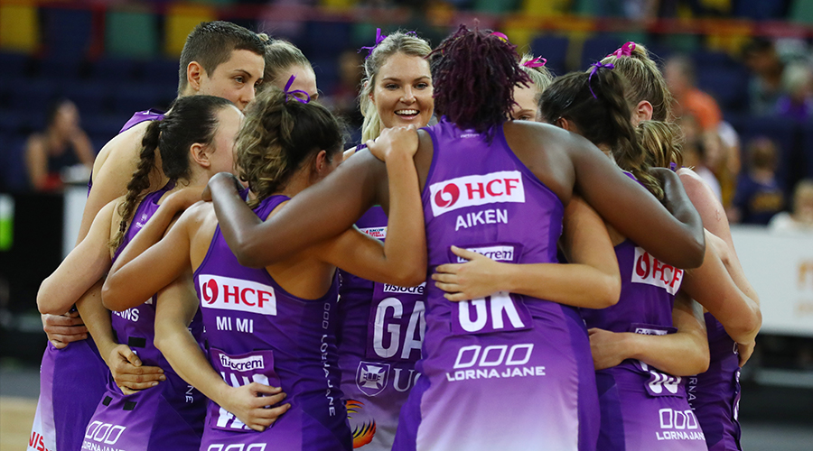 The Queensland Firebirds huddle up before their match against the Sunshine Coast Lightning at USC Stadium in 2019.