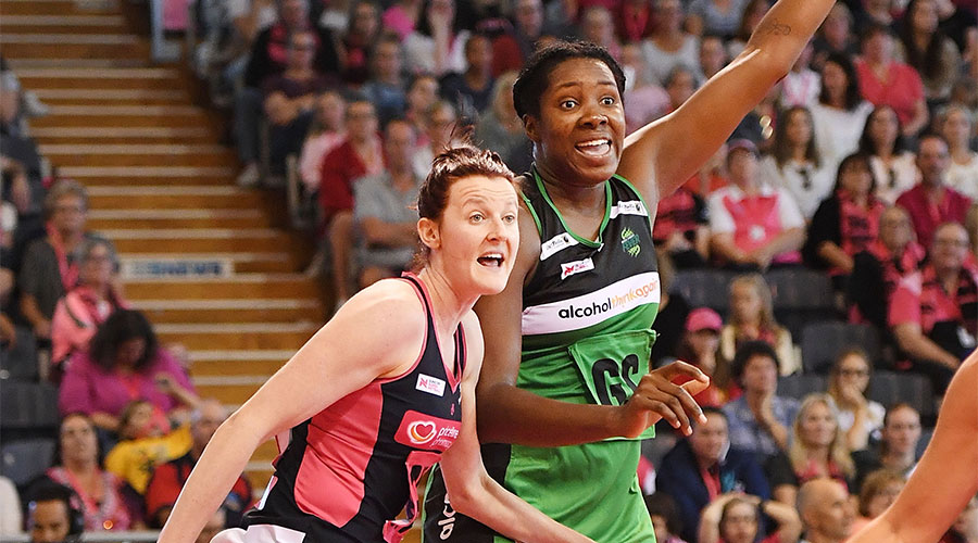 Jhaniele Fowler calling for the ball whilst being defended by Kate Shimmin
