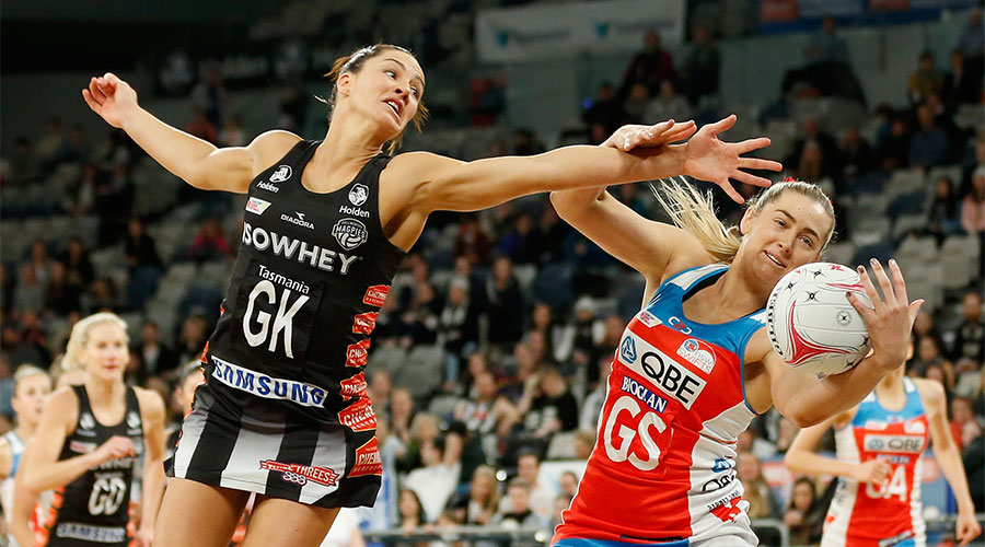 Sharni Layton trying to deflect the ball from Sophie Garbin