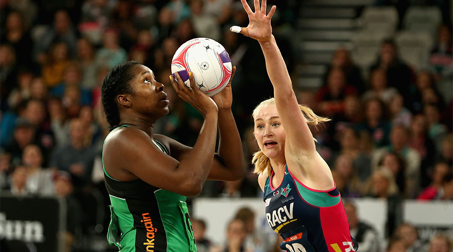 Jhaniele Fowler shooting for a goal with Jo Weston defending