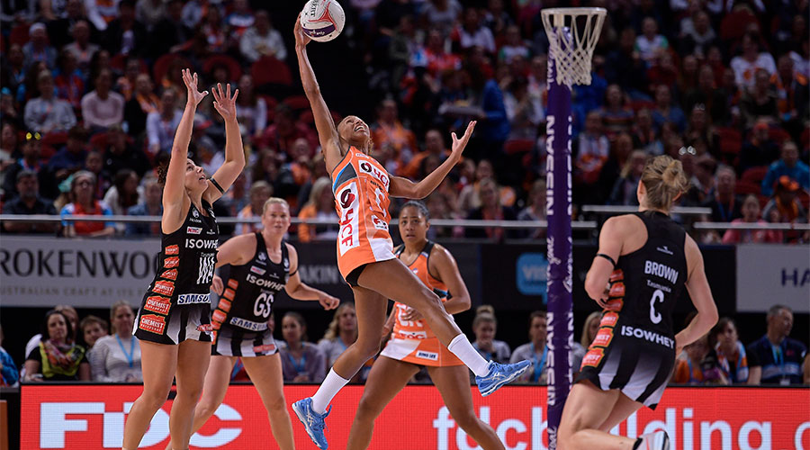 Serena Guthrie jumping up to reach for the ball in a game against the Magpies