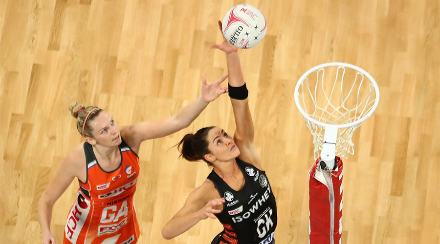 Sharni Layton jumping up for a rebound against Jo Harten