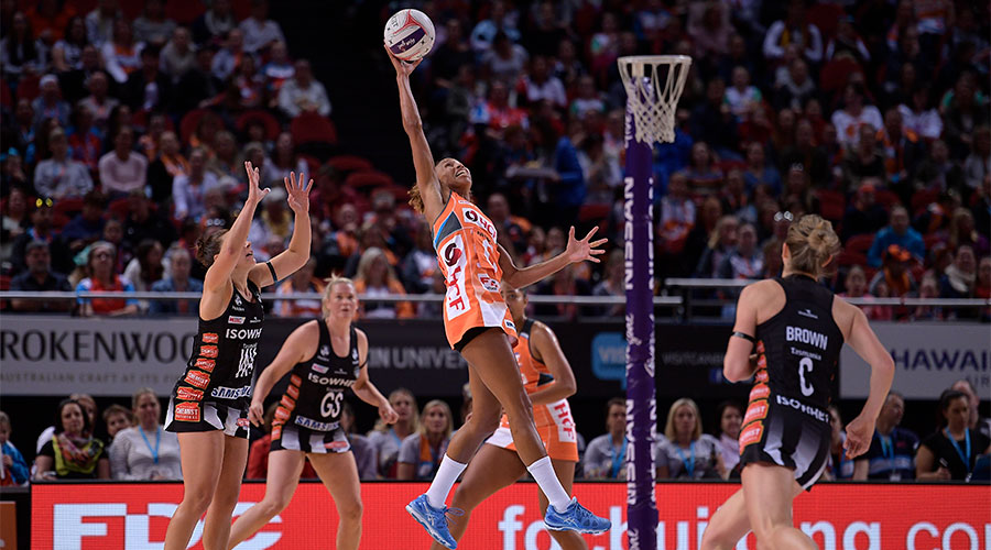 Serena Guthrie jumping up to reach for the ball in a game against the Magpies