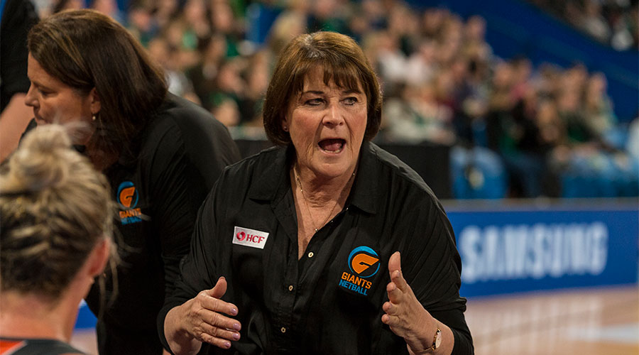 Julie Fitzgerald coaching the Giants on the sidelines of the court