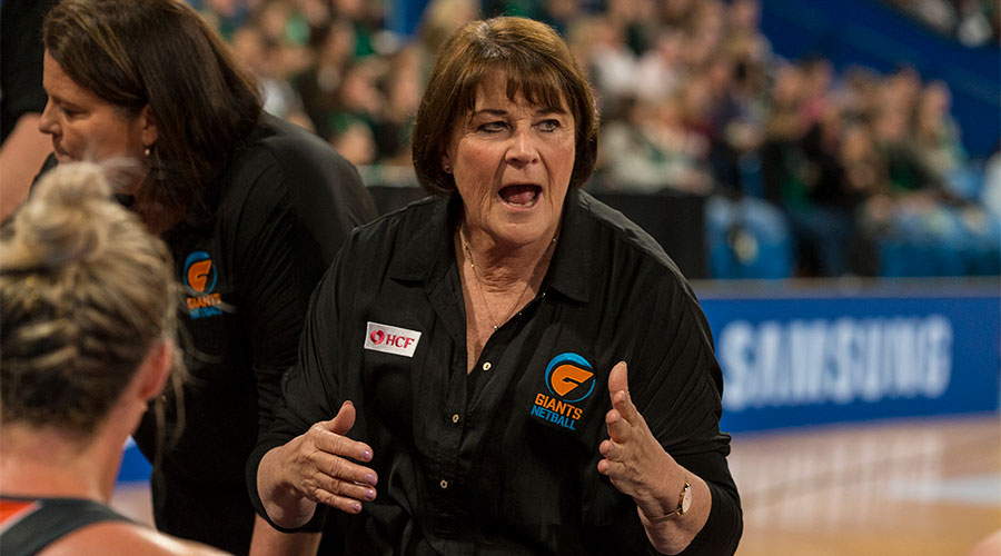 Julie Fitzgerald coaching the Giants on the sidelines of the court