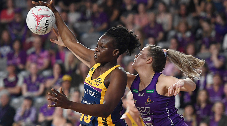  Kim Jenner of the Firebirds contests the ball with Peace Proscovia of the Lightning during the round 10 Super Netball match between the Firebirds and the Lightning at Brisbane Arena on July 27, 2019 in Brisbane, Australia.