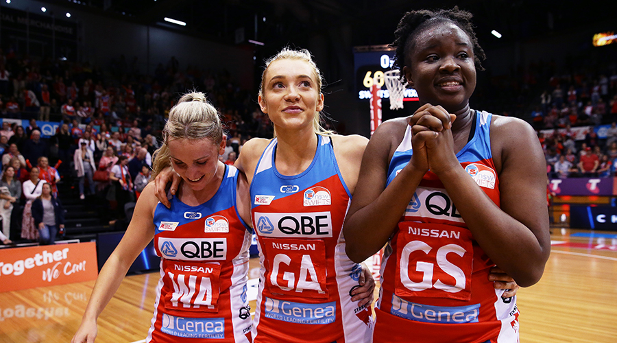 Nat Haythornthwaite, Helen Housby and Sam Wallace of the NSW Swifts celebrate after their Preliminary Final win over the Melbourne Vixens at Sydney's Quaycentre.