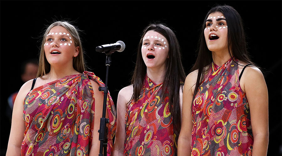 Girls singing for Indigenous round of Super Netball