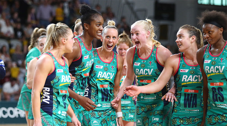 Vixens team celebrating their win against the Firebirds during Indigenous round