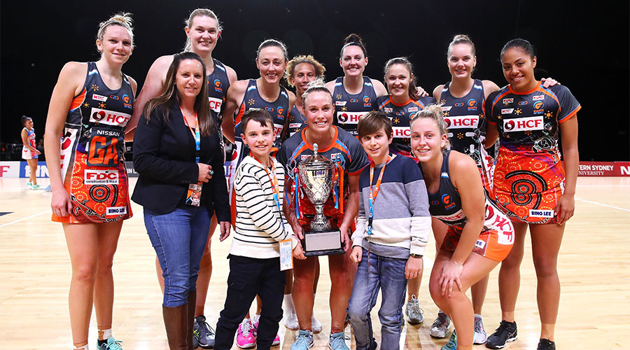 Giants team celebrating a win against cross town rivals the Swifts
