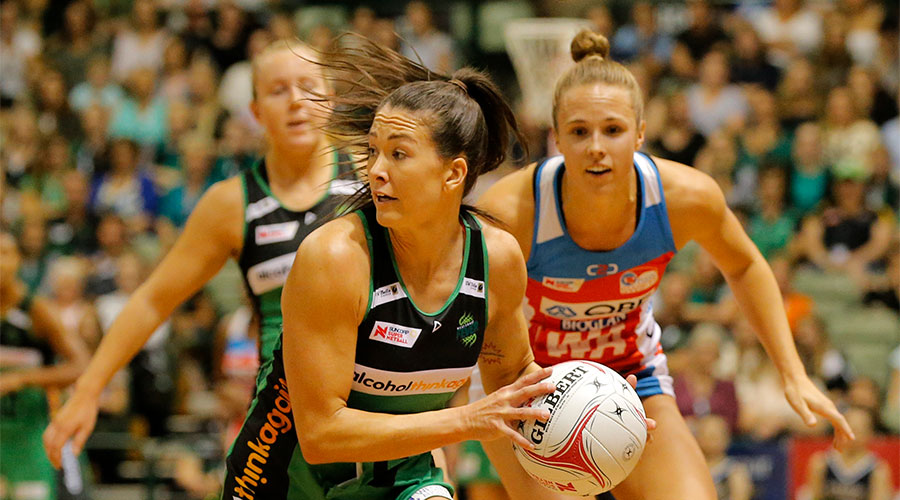 Verity Charles passing the ball against Swifts defenders