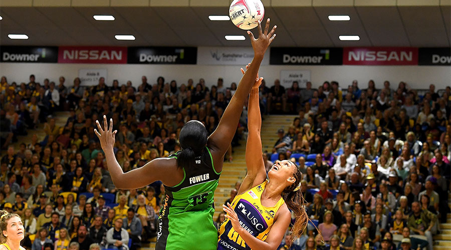 Jhaniele Fowler and Geva Mentor jumping in the air for possession of the ball