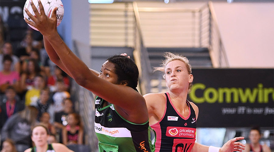 Jhaniele Fowler reaching for the ball whilst being defended by Leana de Bruin