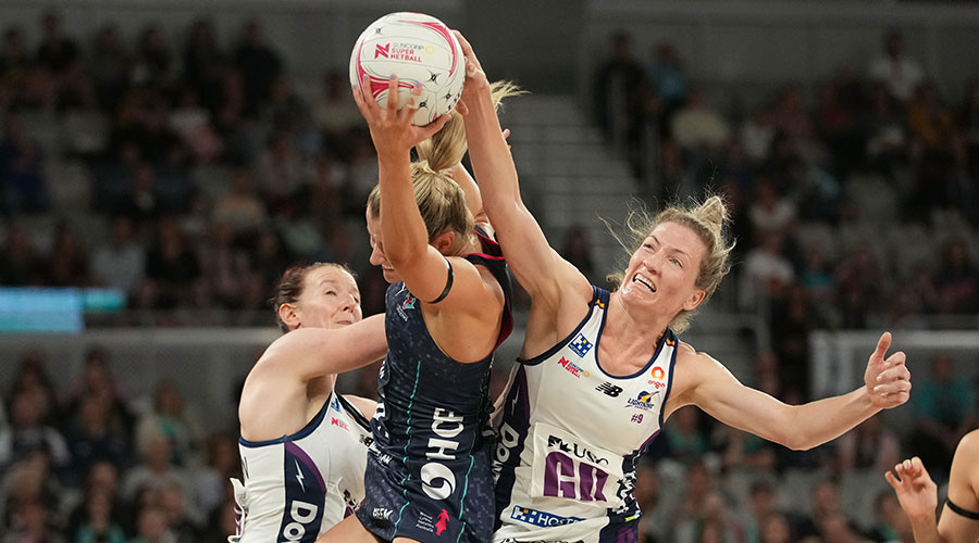 Melbourne Vixens shooter Ruby Barkmeyer competes for a rebound with Sunshine Coast Lightning defender Karla Pretorius during their Round 2 clash at John Cain Arena in Melbourne, 2021.