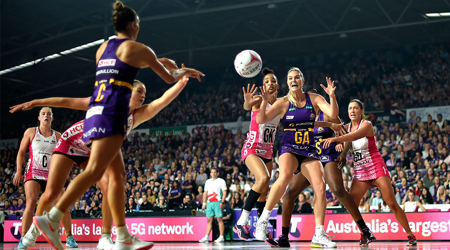Gretel Bueta of the Firebirds receives a pass from Kim Ravaillion during the Round 2 Super Netball match between the Queensland Firebirds and Adelaide Thunderbirds at Nissan Arena in Brisbane, Sunday, May 9, 2021.