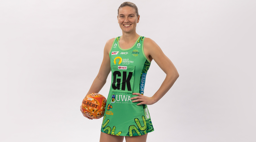 Courtney Bruce of the West Coast Fever models her Club's 2021 Indigenous Round dress.