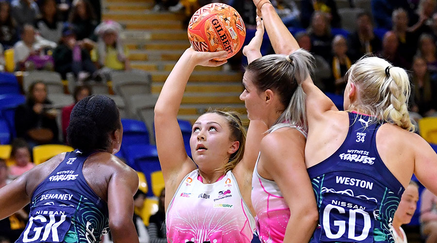 Georgie Horjus (centre) of the Thunderbirds shoots for goal during the Round 6 Super Netball match between the Melbourne Vixens and Adelaide Thunderbirds at USC Stadium on the Sunshine Coast, Sunday, June 6, 2021. 