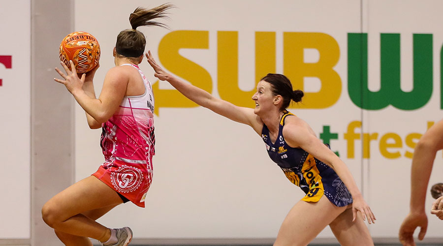 Maisie Nankivell of the Thunderbirds under pressure from Kate Shimmin of the Lightning during the Round 5 Super Netball match between the Adelaide Thunderbirds and Sunshine Coast Lightning at Netball SA Stadium in Adelaide, Sunday, May 30, 2021. 