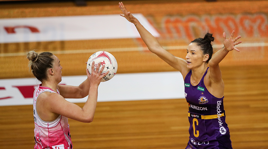 Kim Ravaillion of the Firebirds defends Hannah Petty of the Thunderbirds during the Round 10 Super Netball match between the Adelaide Thunderbirds and Queensland Firebirds at Netball SA Stadium in Adelaide, Sunday, July 11, 2021