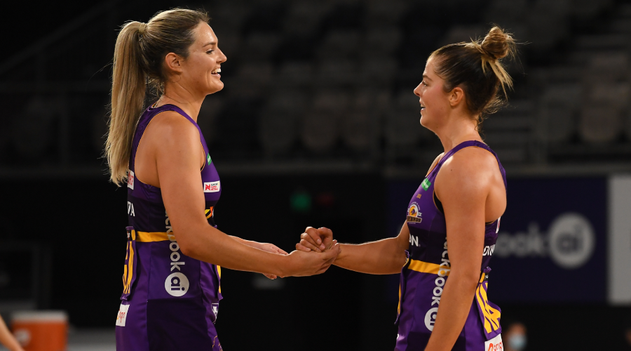 Lara Dunkley (right) and Gretel Bueta of the Firebirds celebrate after defeating the Giants in the Round 9 Super Netball match between the Queensland Firebirds and GWS Giants at John Cain Arena in Melbourne, Sunday, July 4, 2021. 