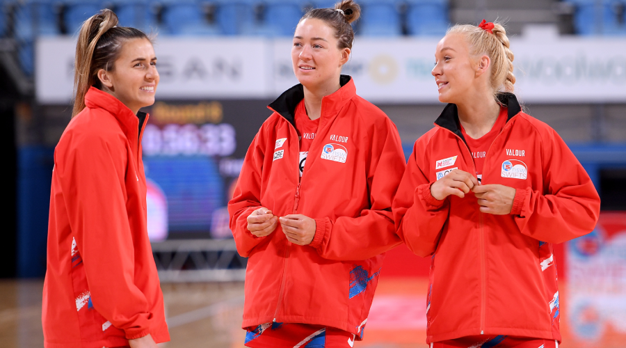 Maddy Proud, Lauren Moore and Tayla Fraser of the Swifts during the warm up ahead of the Super Netball Round 8 match between NSW Swifts and Queensland Firebirds at Ken Rosewall Arena in Sydney, Saturday, June 19, 2021. 