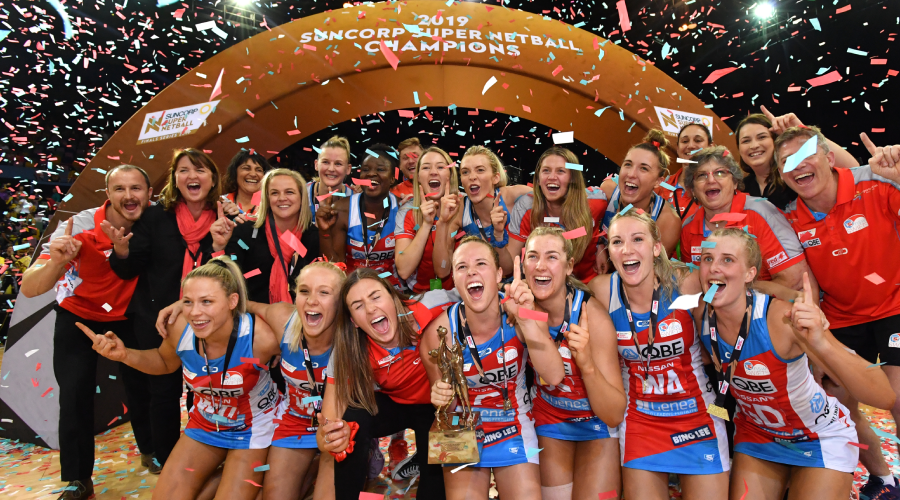 Swifts players celebrate winning the Super Netball Grand Final match between the Sunshine Coast Lightning and the New South Wales Swifts at the Brisbane Entertainment Centre in Brisbane, Sunday, September 15, 2019.