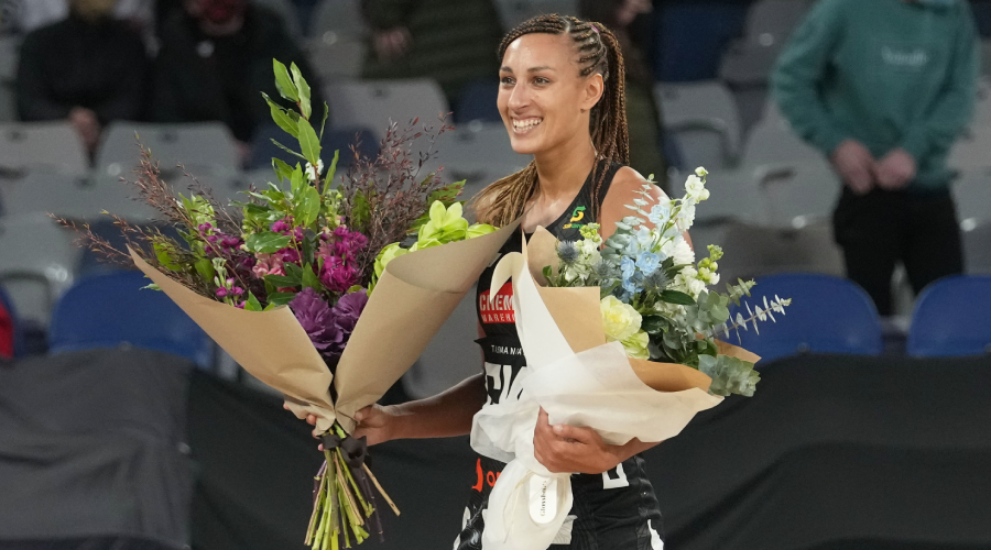 Geva Mentor of the Magpies poses during a presentation after playing her 200th game during the Round 10 Super Netball match between the Collingwood Magpies and GWS Giants at John Cain Arena in Melbourne, Sunday, July 11, 2021.