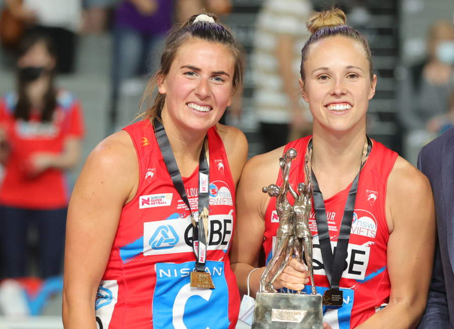 Swifts Maddy Proud and Paige Hadley with Suncorp CEO Steve Johnston after winning the Super Netball Grand Final match between GIANTS Netball and NSW Swifts at Nissan Arena in Brisbane, Saturday, August 28, 2021.