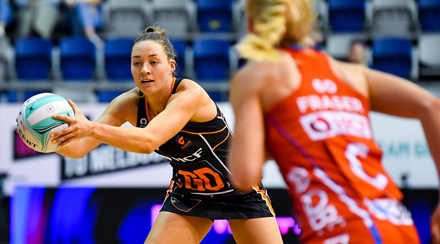 Giants Lauren Moore makes a pass during the Super Netball: Team Girls Cup match between NSW Swifts and GIANTS Netball at Parkville Stadium in Melbourne, Sunday, February 27, 2022.