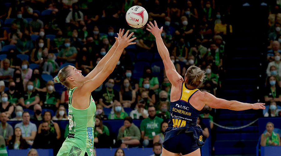 Courtney Bruce of the Fever and Laura Scherian of the Lightning compete for the ball during the Round 1 Super Netball match between the West Coast Fever and Sunshine Coast Lightning at RAC Arena, Perth, Sunday, March 27, 2022.