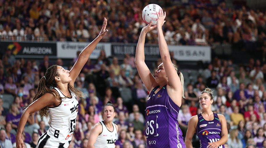 Donnell Wallam of the Firebirds in action with Geva Mentor the Magpies during the Super Netball Round 6 match between the Queensland Firebirds and the Collingwood Magpies at Nissan Arena in Brisbane, Sunday , April 24, 2022
