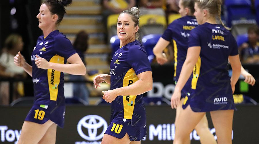Laura Scherian of the Lightning (center) leads the warm up before the Super Netball Round 2 match between Sunshine Coast Lightning and Queensland Firebirds at USC Stadium on the Sunshine Coast, Saturday, April 2, 2022.