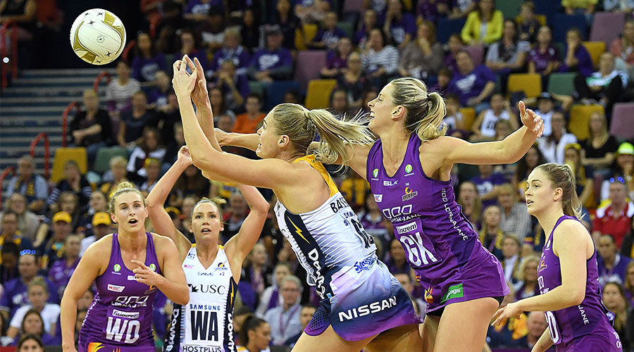 Laura Geitz of the Firebirds (right) competes with Caitlin Bassett of the Lightning during the Super Netball Minor Semi Final match between the Queensland Firebirds and the Sunshine Coast Lightning at the Brisbane Entertainment Centre in Brisbane, Sunday, August 12, 2018.