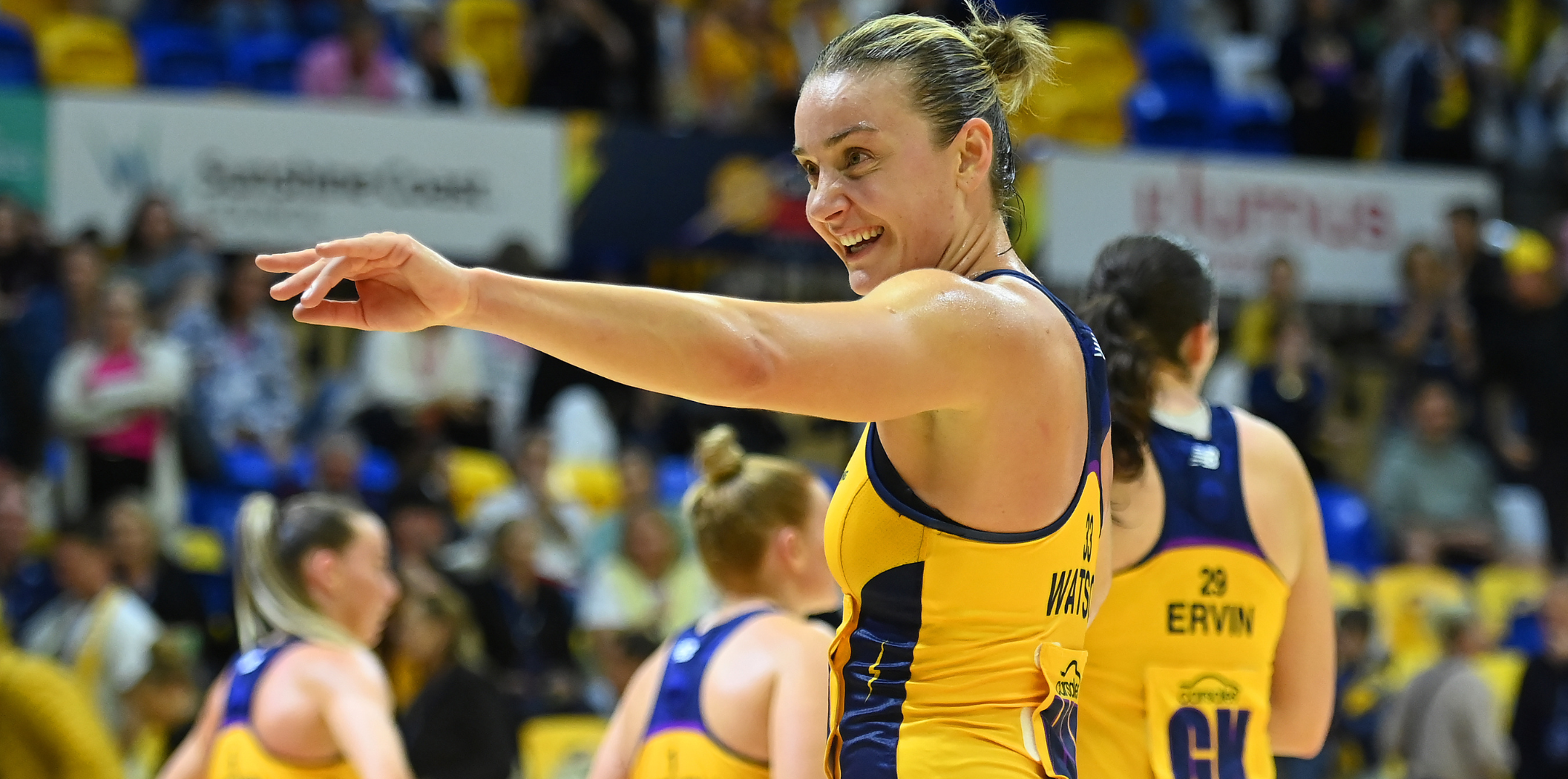 Liz Watson waves to a fan in the crowd