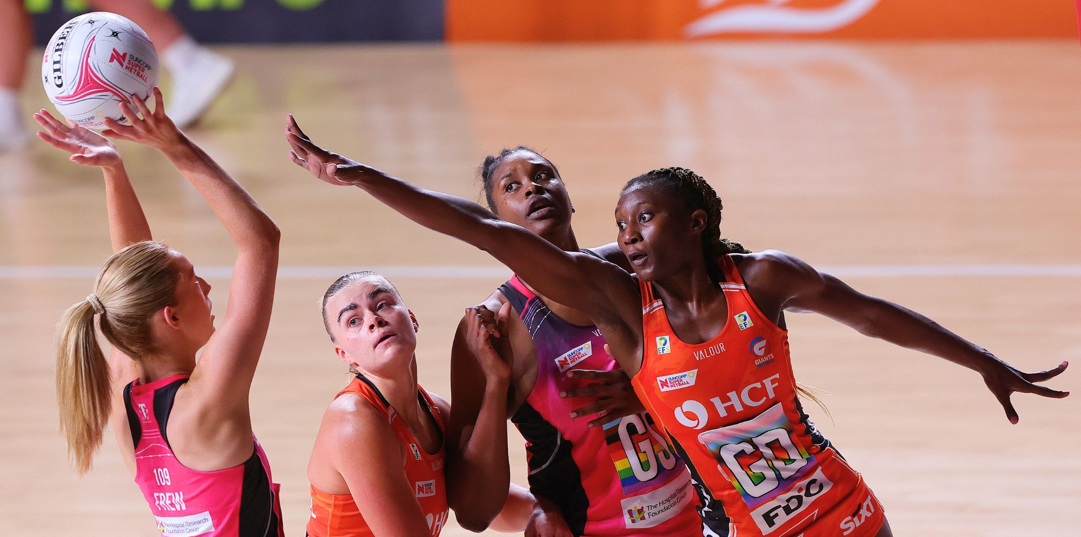 Lauren Frew shoots under pressure from the GIANTS Jodi-Ann Ward