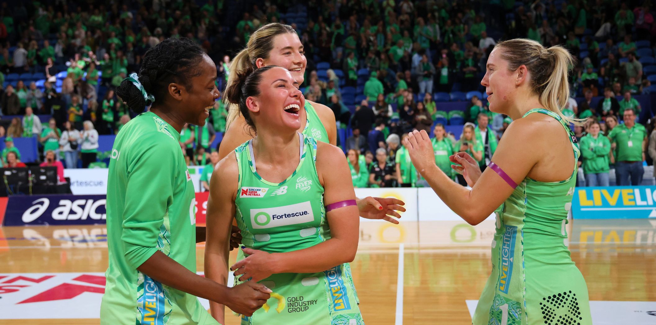 Fever teammates laugh post win